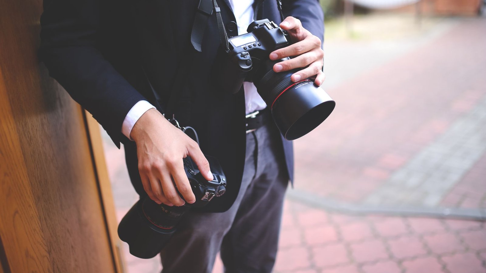 Photographer framing a bright outdoor shot before adding text captions to the photo