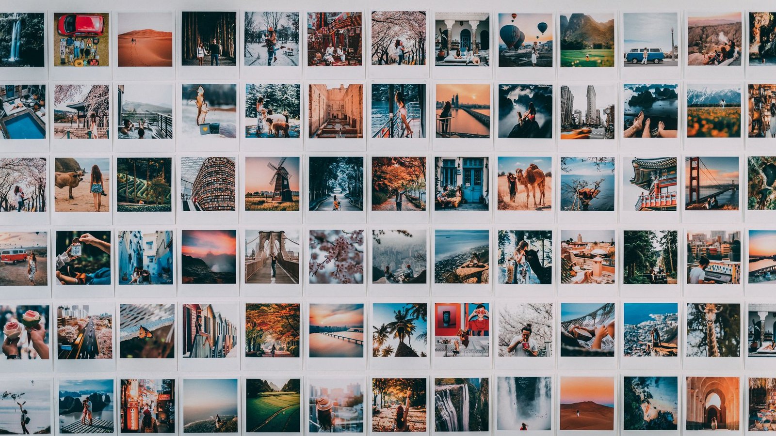 A vibrant wall collage featuring various travel-themed polaroid photographs.
