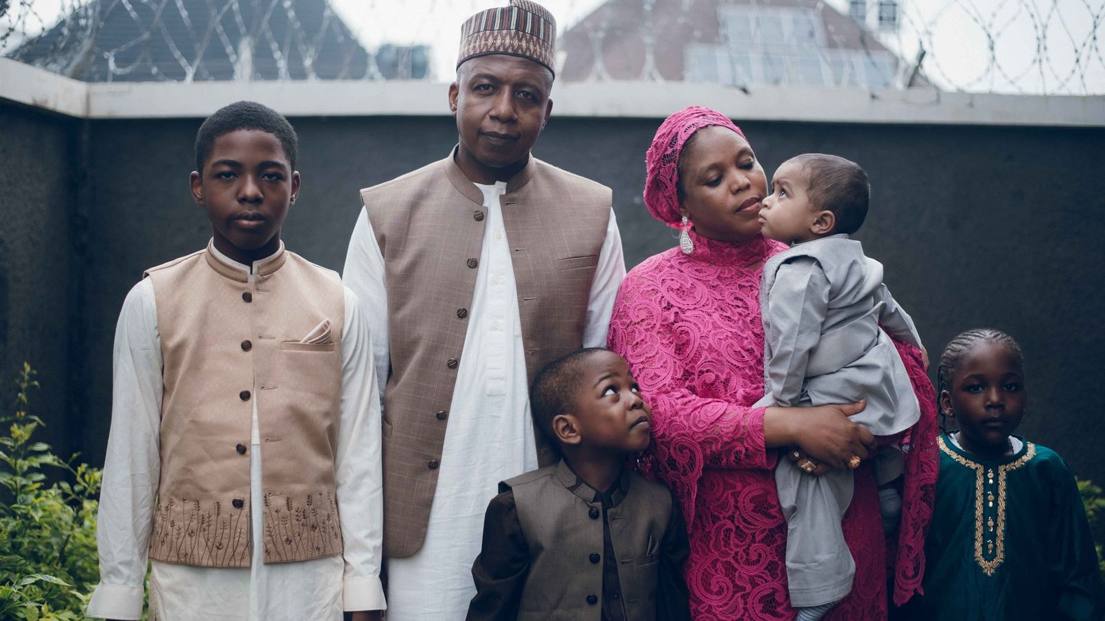 Portrait of an African family in traditional clothing, outdoors.