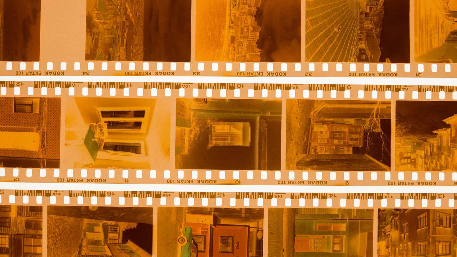 Close-up of vintage Kodak film negatives on a light table, showcasing nostalgic photographic captures.