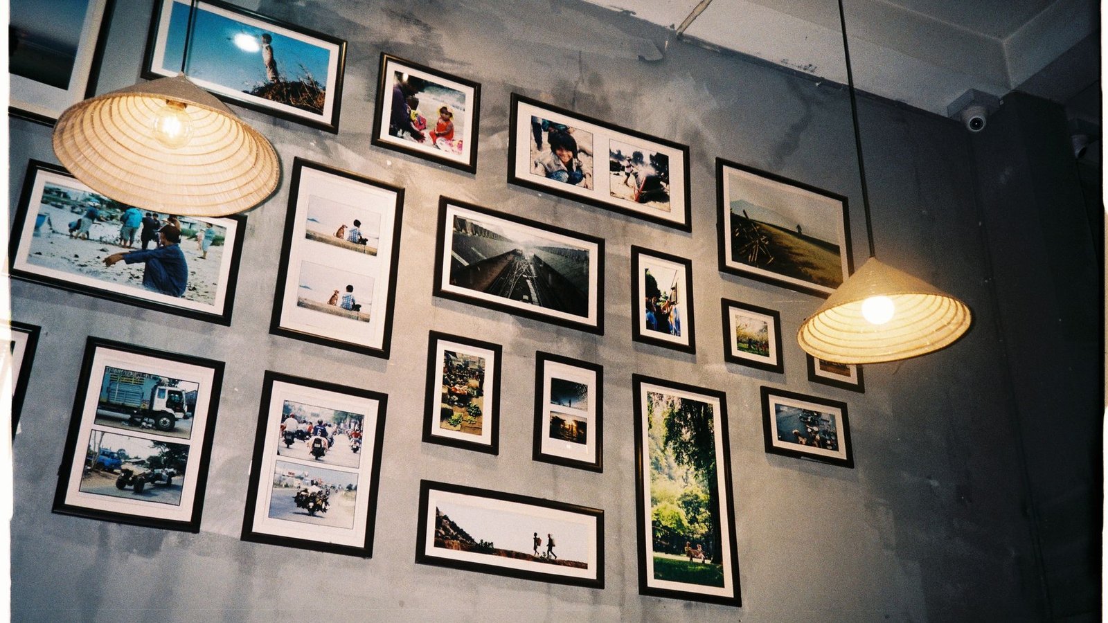 Framed photo prints arranged on a bright wall, the end result of print quality merged images